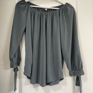 Blouse top with tie sleeves.